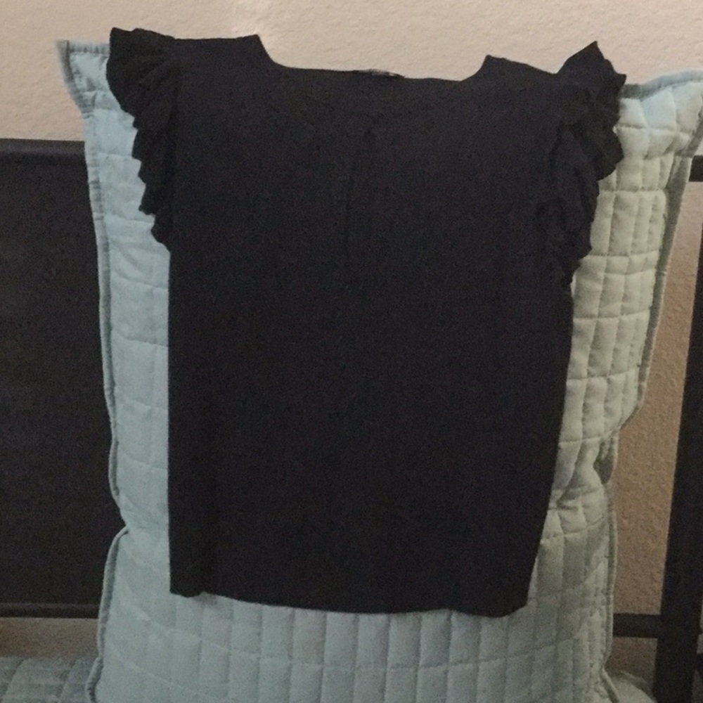 Short black sweater with sexy hole.  Never worn.